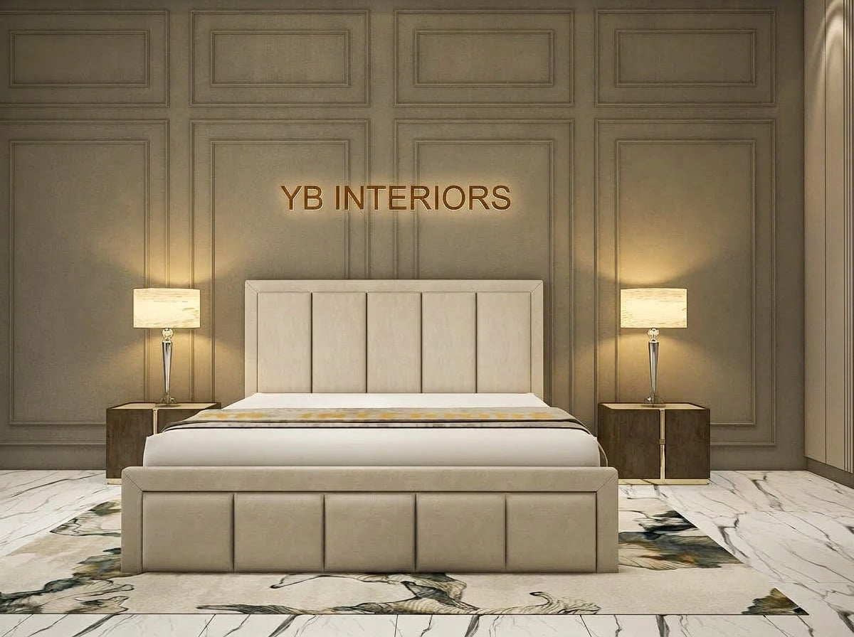 A modern upholstered bed centered in a styled bedroom, with a tall segmented headboard and matching footboard in a light beige fabric. The room has warm gray paneled walls, two matching bedside tables with lit lamps, and a marble-look floor.