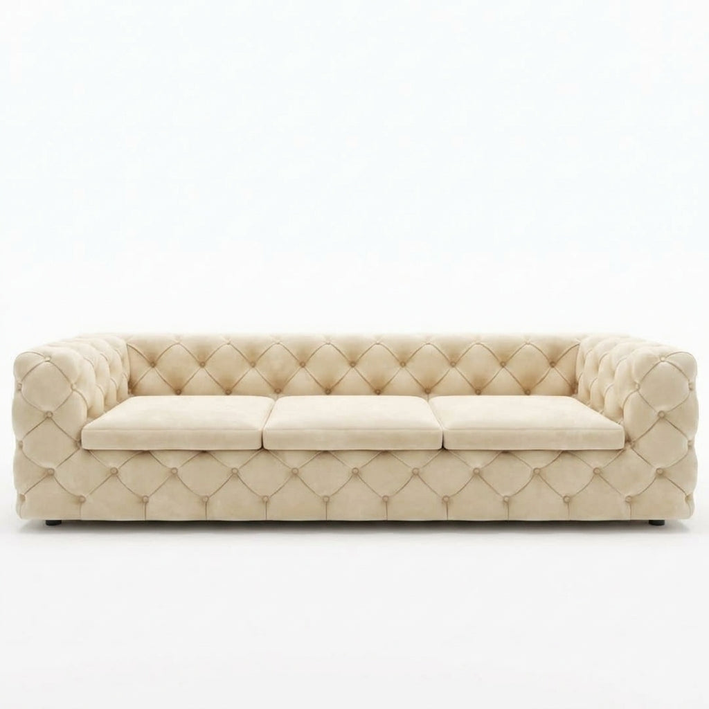 A cream-colored tufted velvet sofa with three seat cushions, shown against a plain white background.