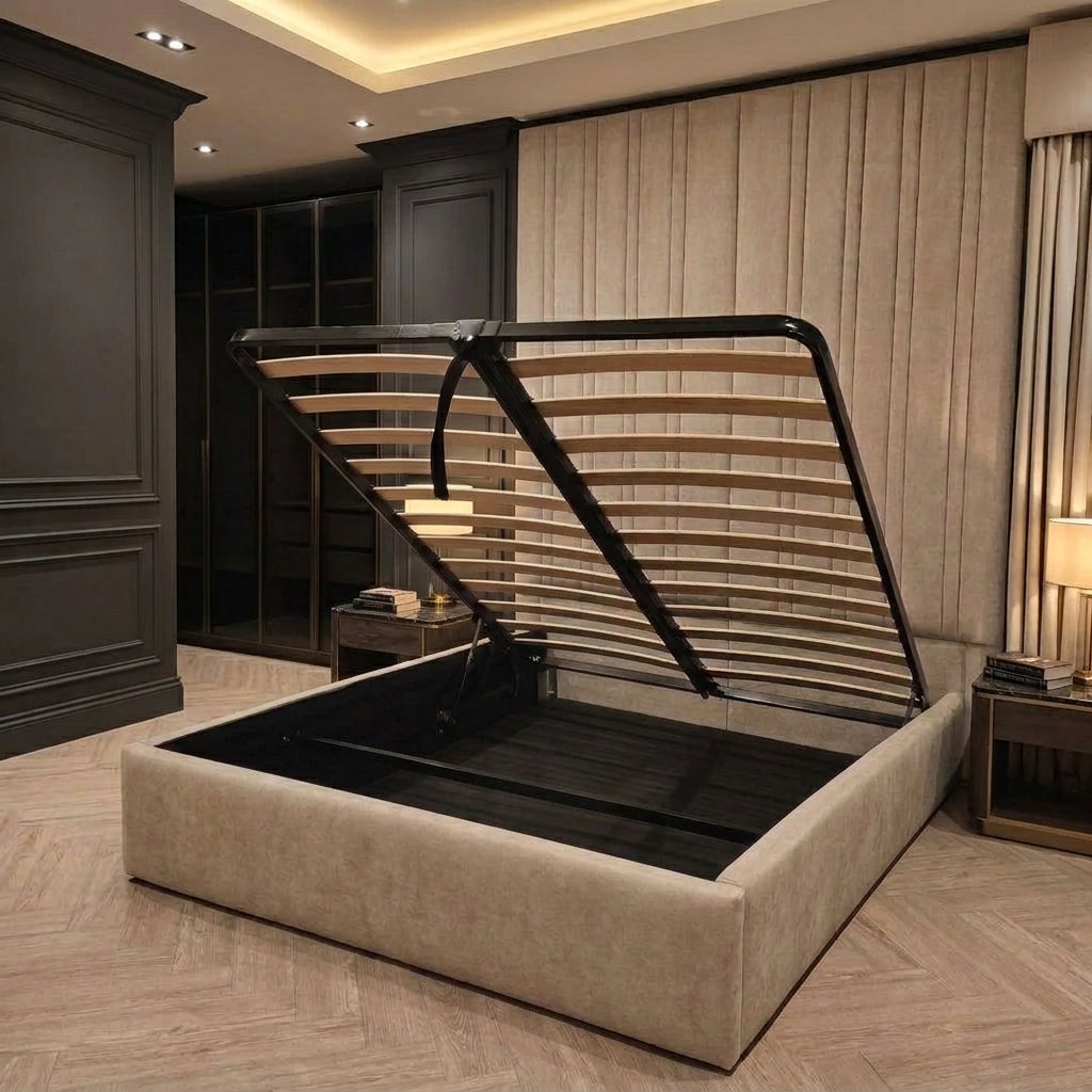 A modern platform storage bed with a light beige upholstered frame and a black metal slatted support structure, shown open in a styled bedroom interior.